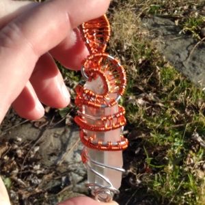 Silver and red wire wrapped lemurian crystal